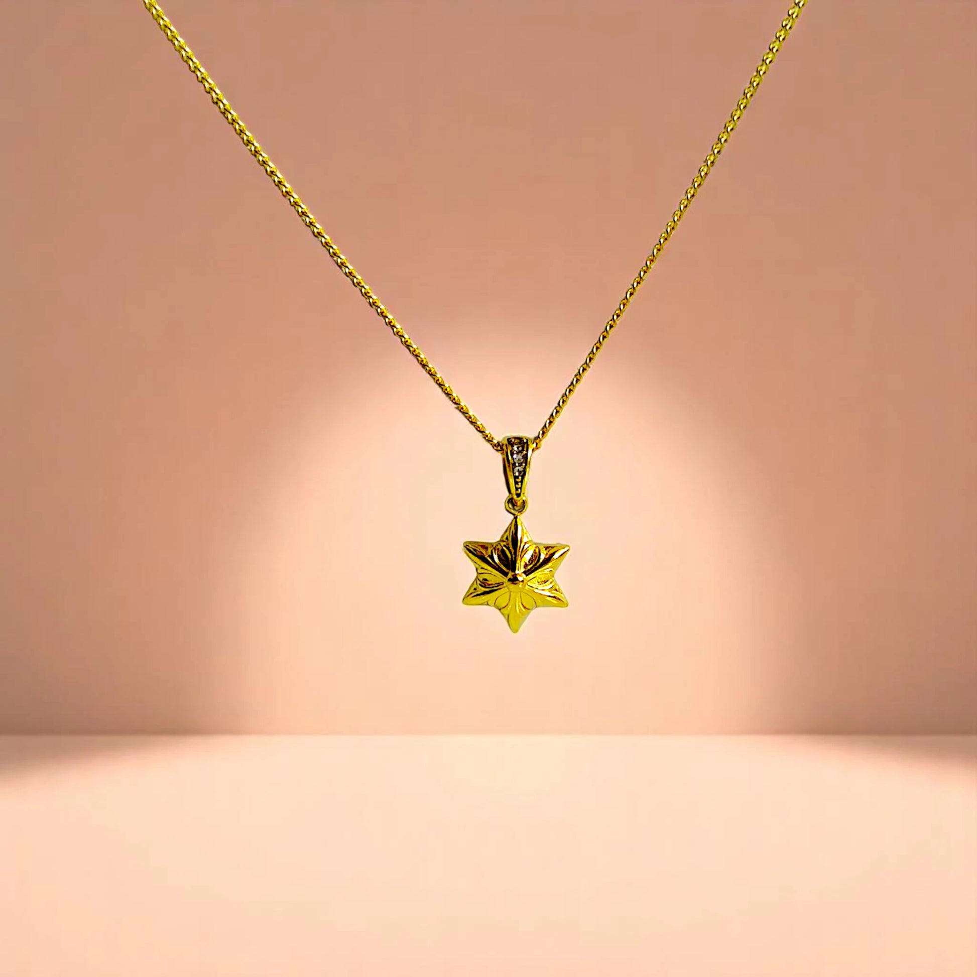 Necklace on a peach-toned gradient background.