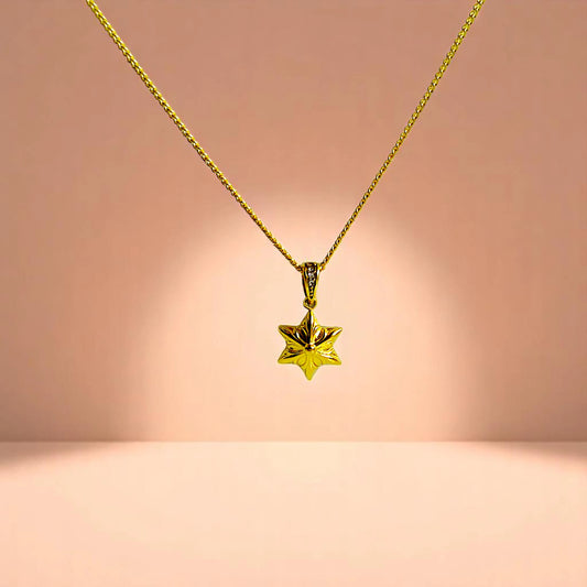 Necklace on a peach-toned gradient background.