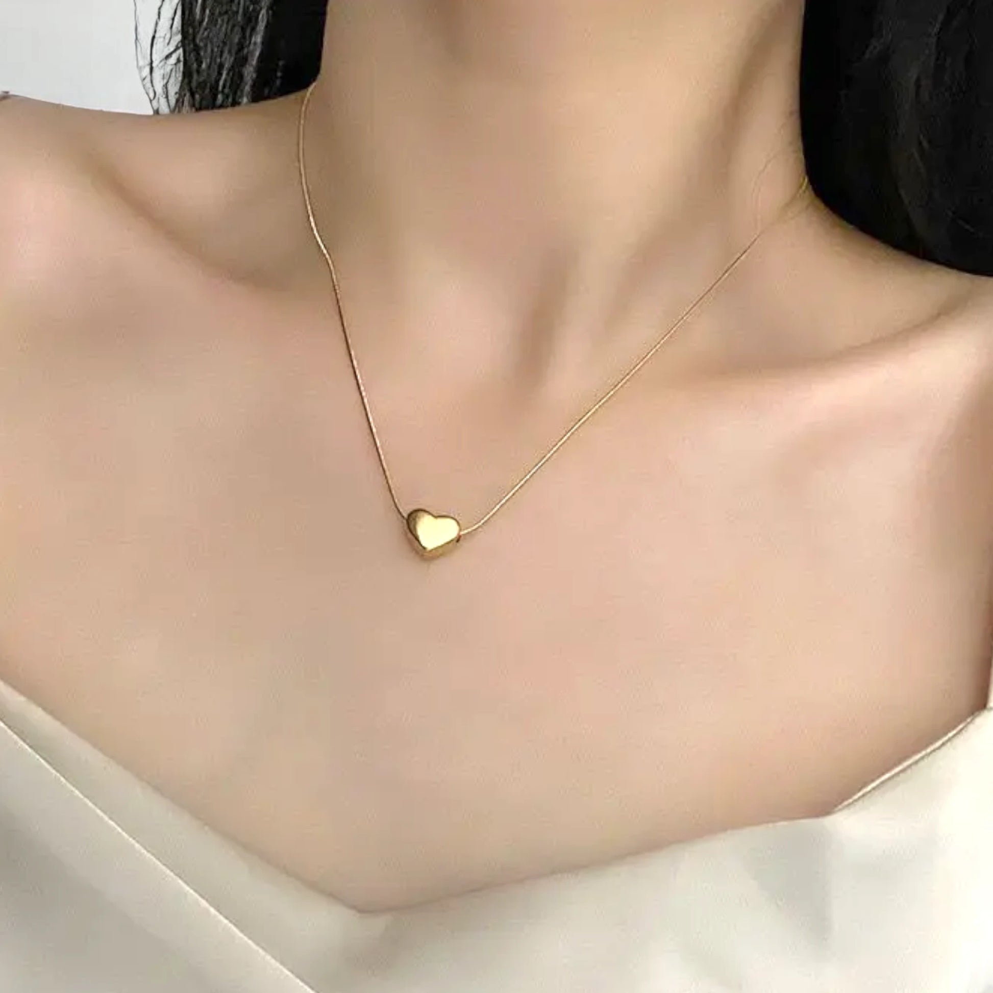 Necklace worn by a model.
