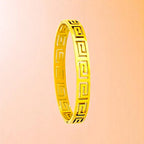 Bracelet on a color gradient of peach tones background.
