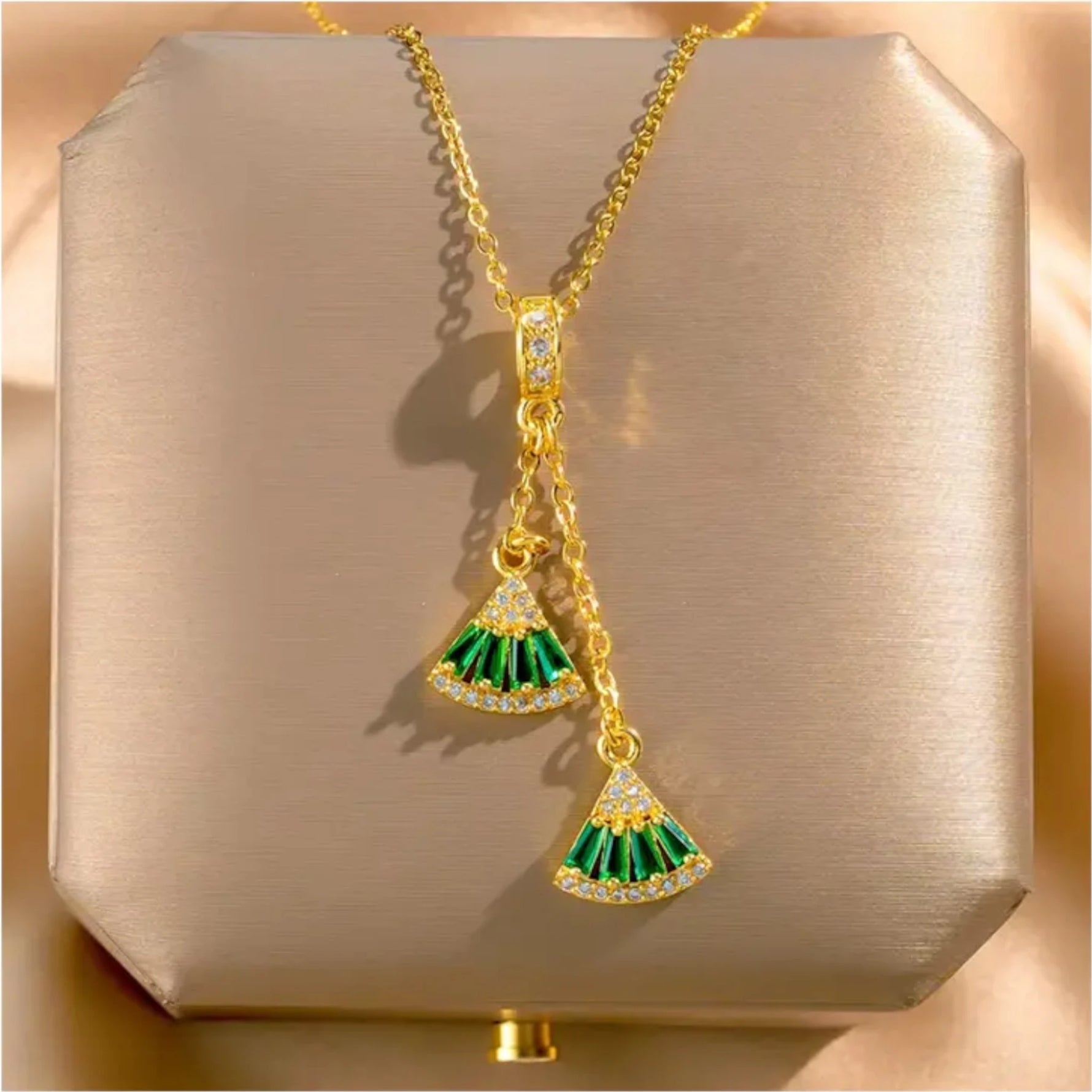 Necklace on a soft fabric box with a light-toned background.
