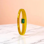 Bracelet set against a soft gradient background.