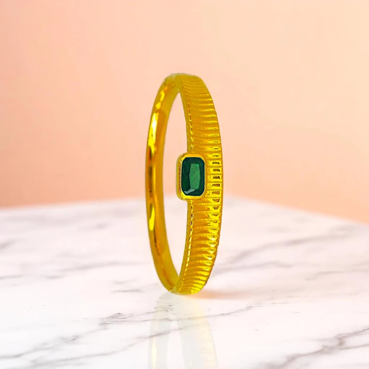 Bracelet set against a soft gradient background.