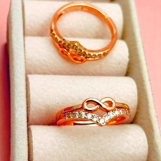 Two rings displayed in a velvet jewelry box.
