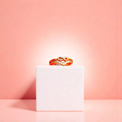 Ring on a white cube geometric prop with a peach color gradient in the background.
