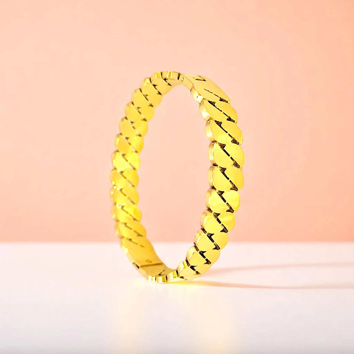 Bracelet set against a soft gradient background.