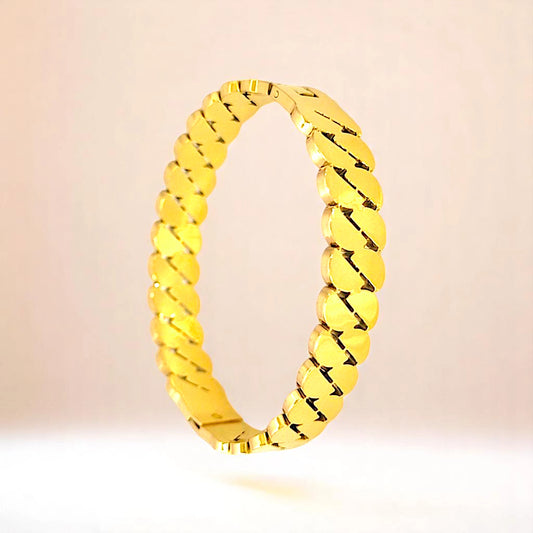 Bracelet on a color gradient of peach tones background.