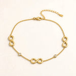 Gold infinity anklet with 3 infinity symbols and 2 bezel CZ stones, cable chain, lobster clasp.