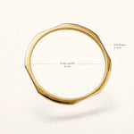 Gold faceted bangle on off-white background with thickness 2mm and inner width 6cm dimension callouts