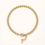 Gold teardrop braided chain bracelet circle, clasp at bottom, warm white.
