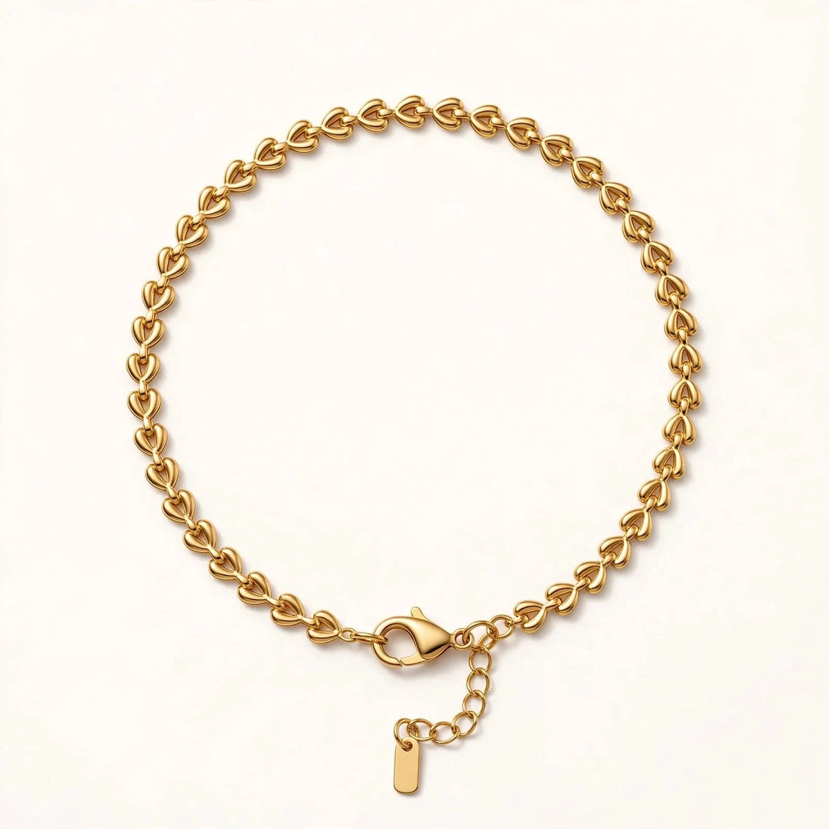 Gold teardrop braided chain bracelet circle, clasp at bottom, warm white.