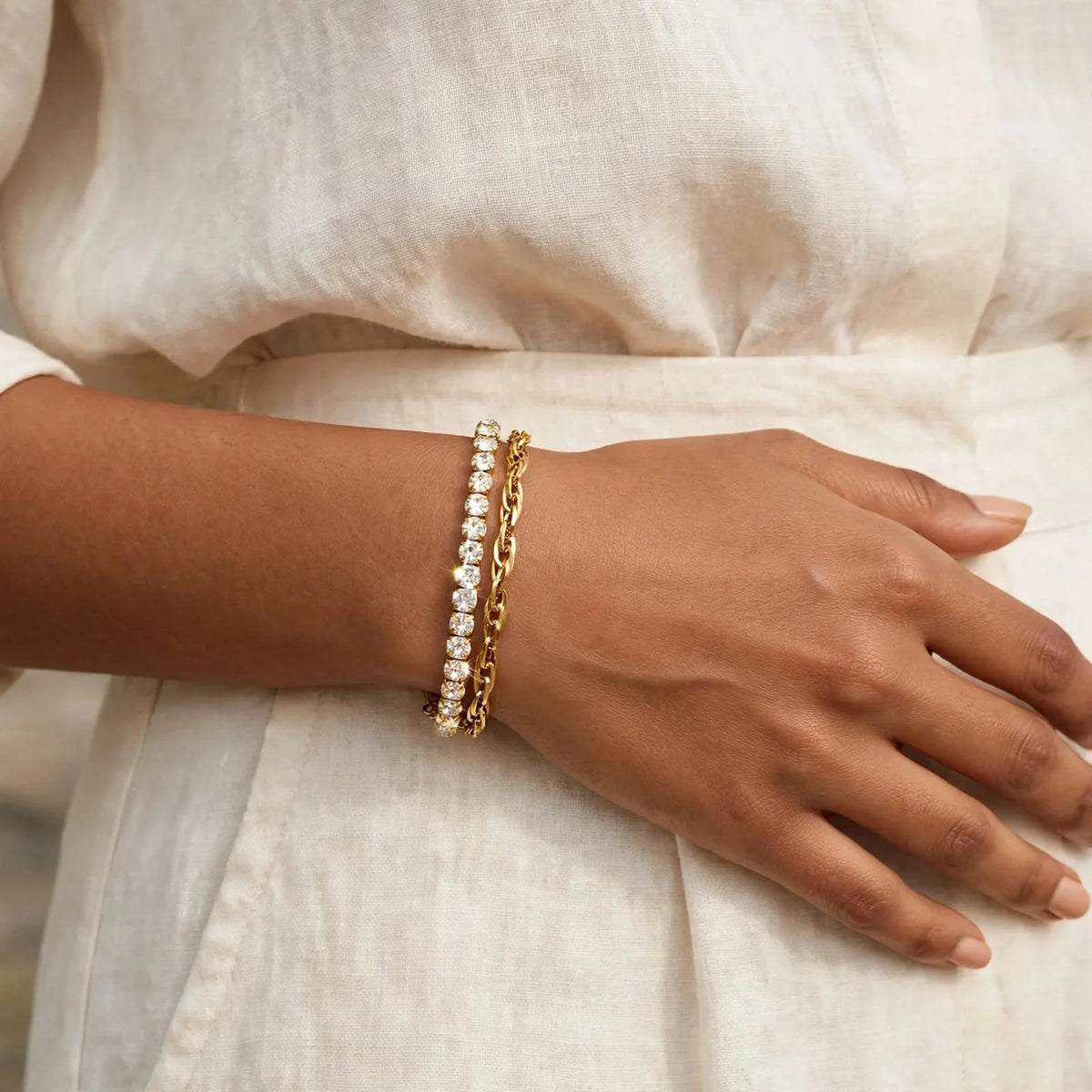 Indian woman in ivory linen shirt wearing gold double-layer bracelet on wrist