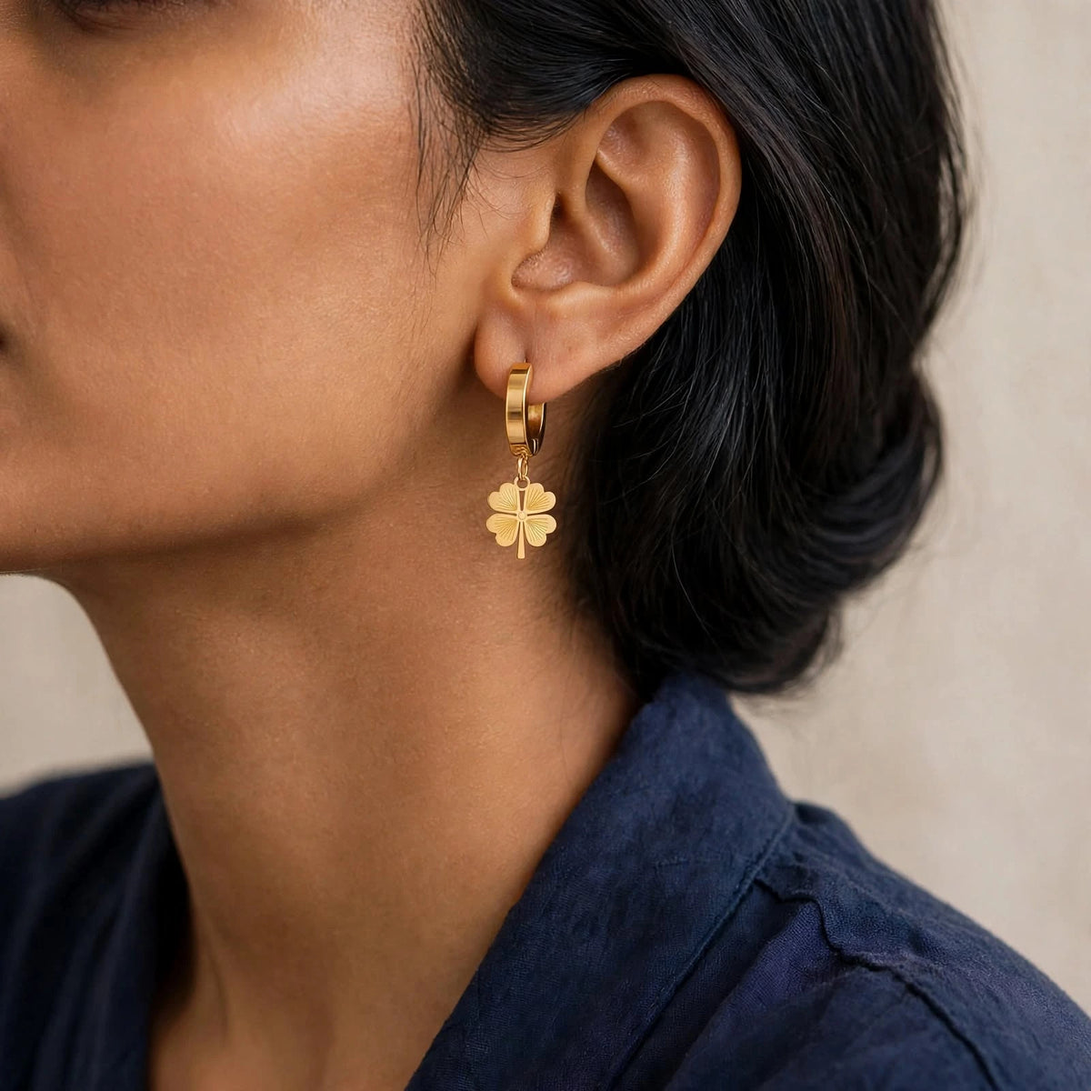 Indian woman profile wearing smaller clover drop earrings