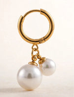 Huggie hoop clicker earring with double pearl drop macro detail