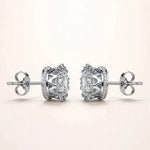 Silver diamond studs sideways with stones on top showing crown sides.