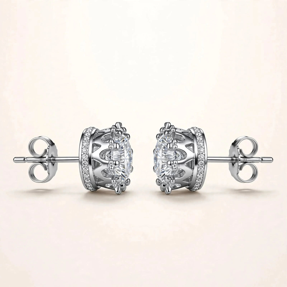 Silver diamond studs sideways with stones on top showing crown sides.