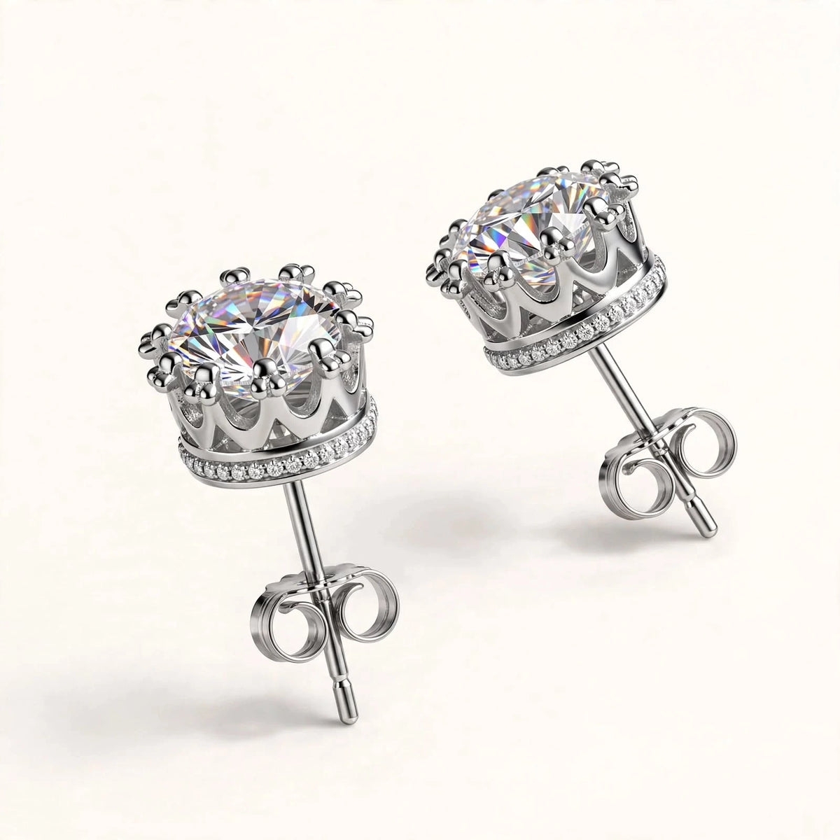 Both silver crown diamond studs stones on top clasp down on invisible riser side view.