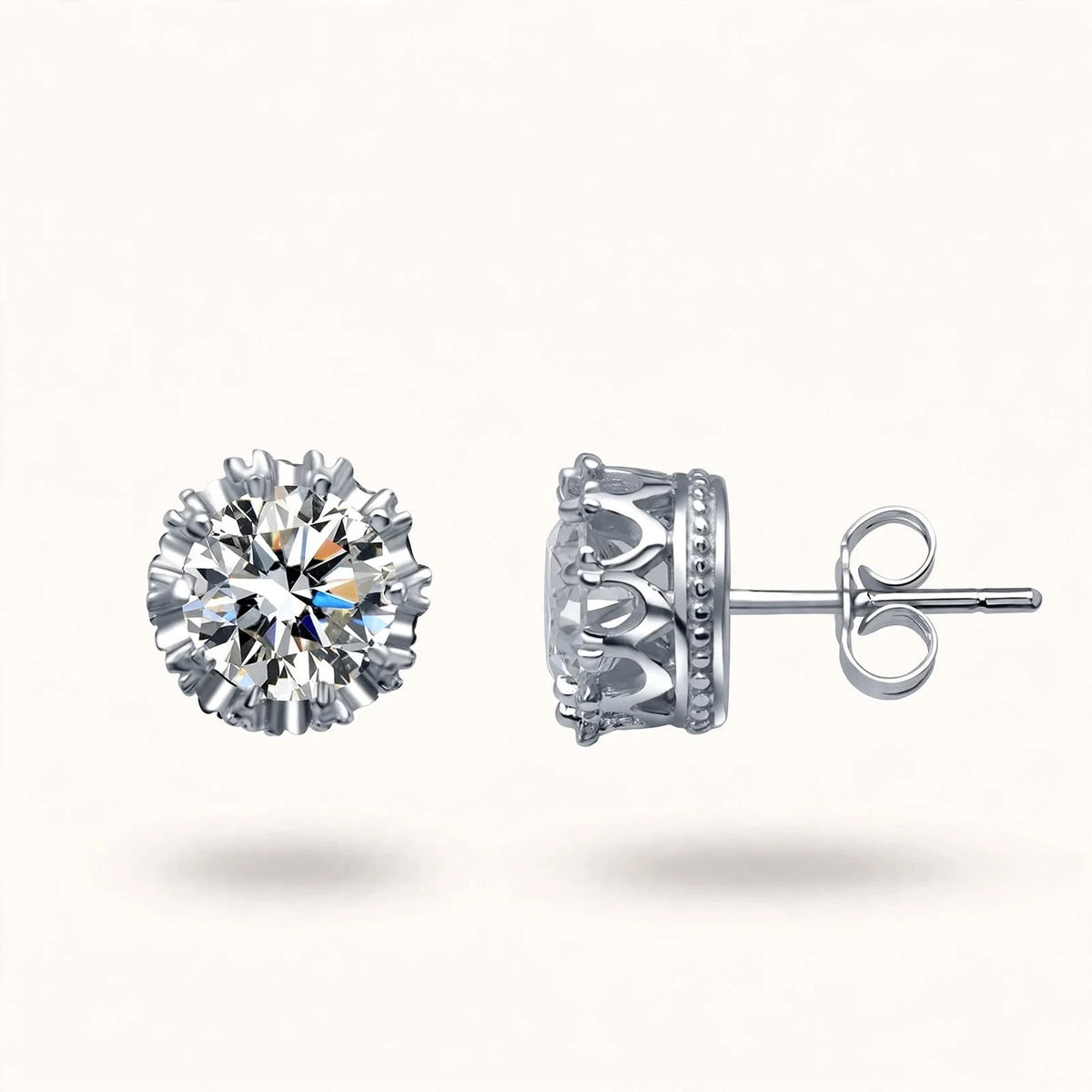 Silver crown diamond studs sideways view showing front and side profile on off-white.