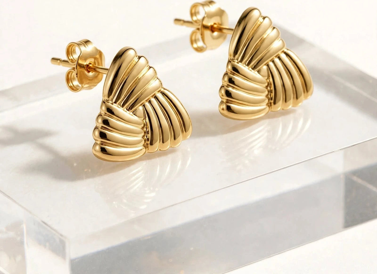 Both gold triangular ribbed earrings side angle showing thickness and butterfly backs.