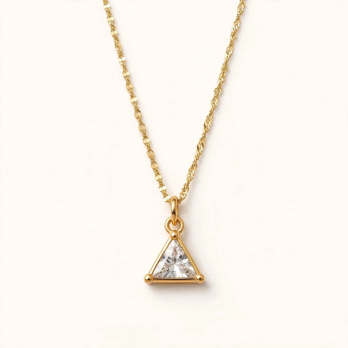 Gold triangular pendant with clear glass crystal triangular stone on Singapore chain