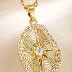 Macro of gold sunburst pendant center star