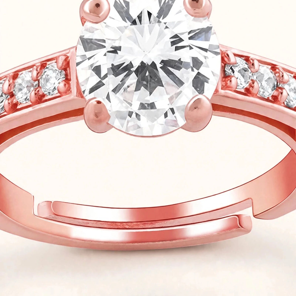 Extreme macro of rose gold solitaire ring showing centre stone and open band ends