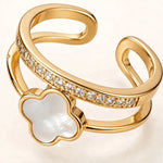 Extreme macro close-up of white clover gold ring showing crystal details