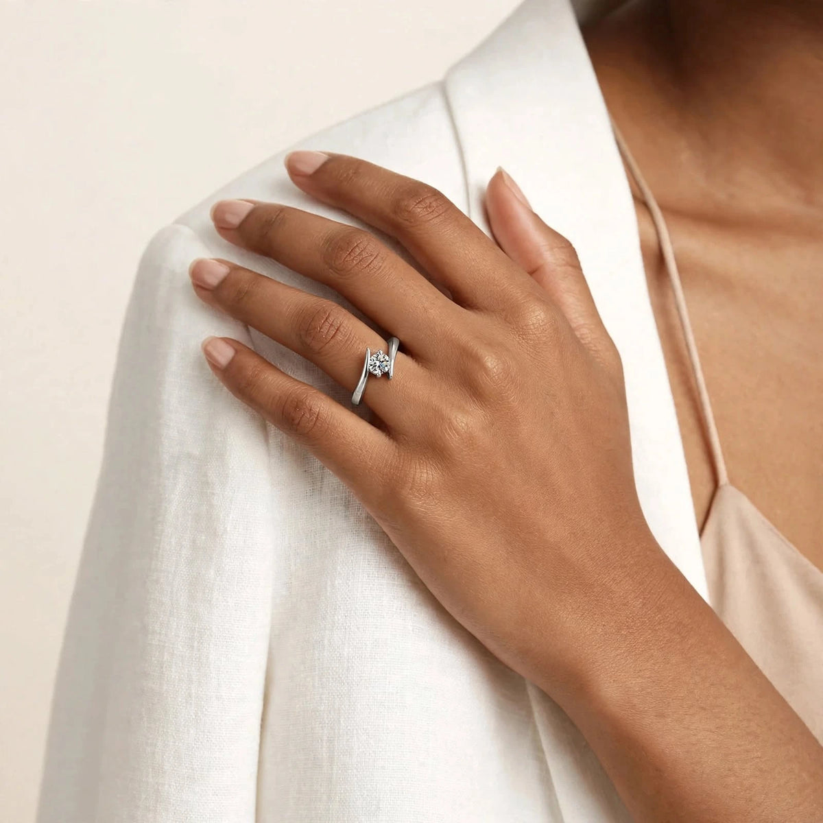 Indian woman hand on shoulder wearing exact silver open solitaire bypass ring.