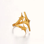 Side profile of gold triple star open ring showing gap and thickness on white background