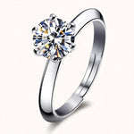 Silver adjustable solitaire ring with 8mm round brilliant stone floating on warm off-white background
