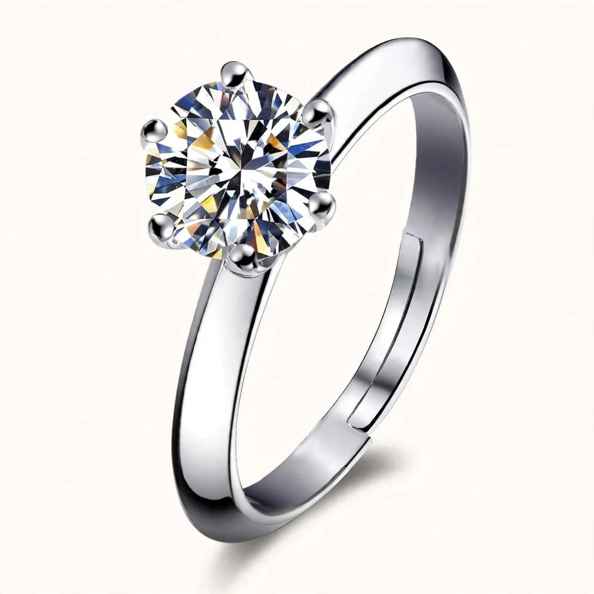 Silver adjustable solitaire ring with 8mm round brilliant stone floating on warm off-white background