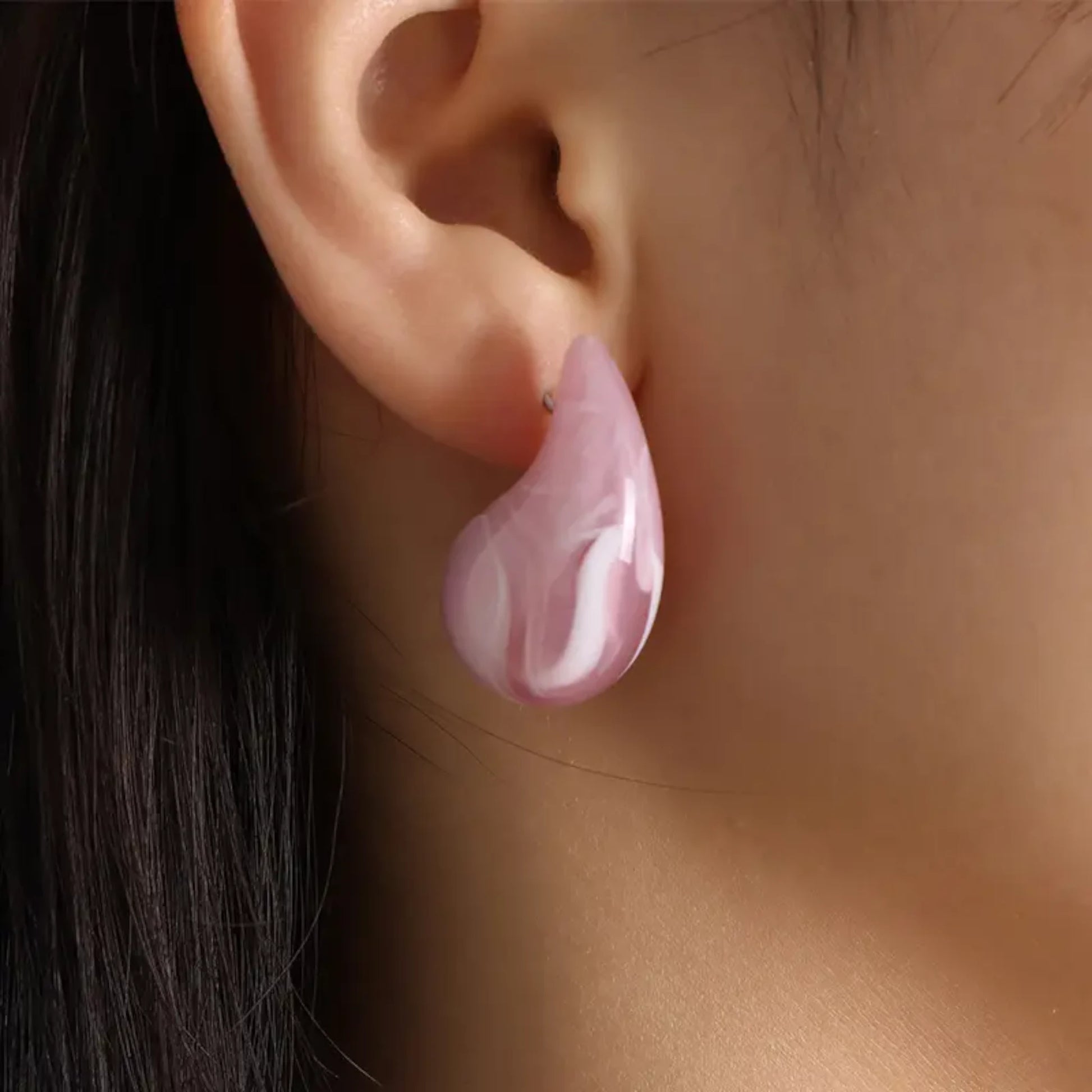 Light Coral Teardrop Earrings worn by a model.
