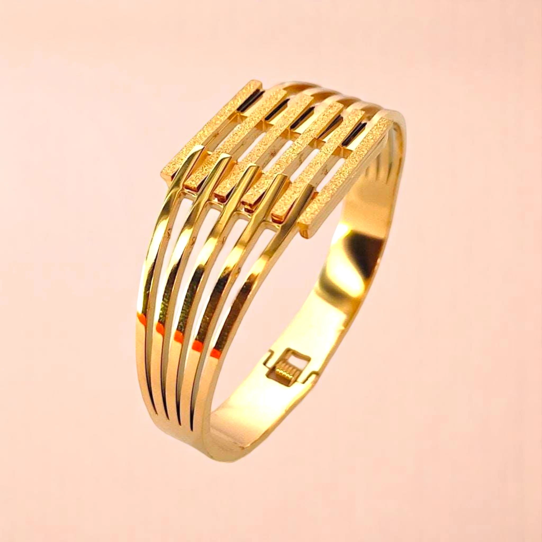 Bracelet on a color gradient of peach tones background.