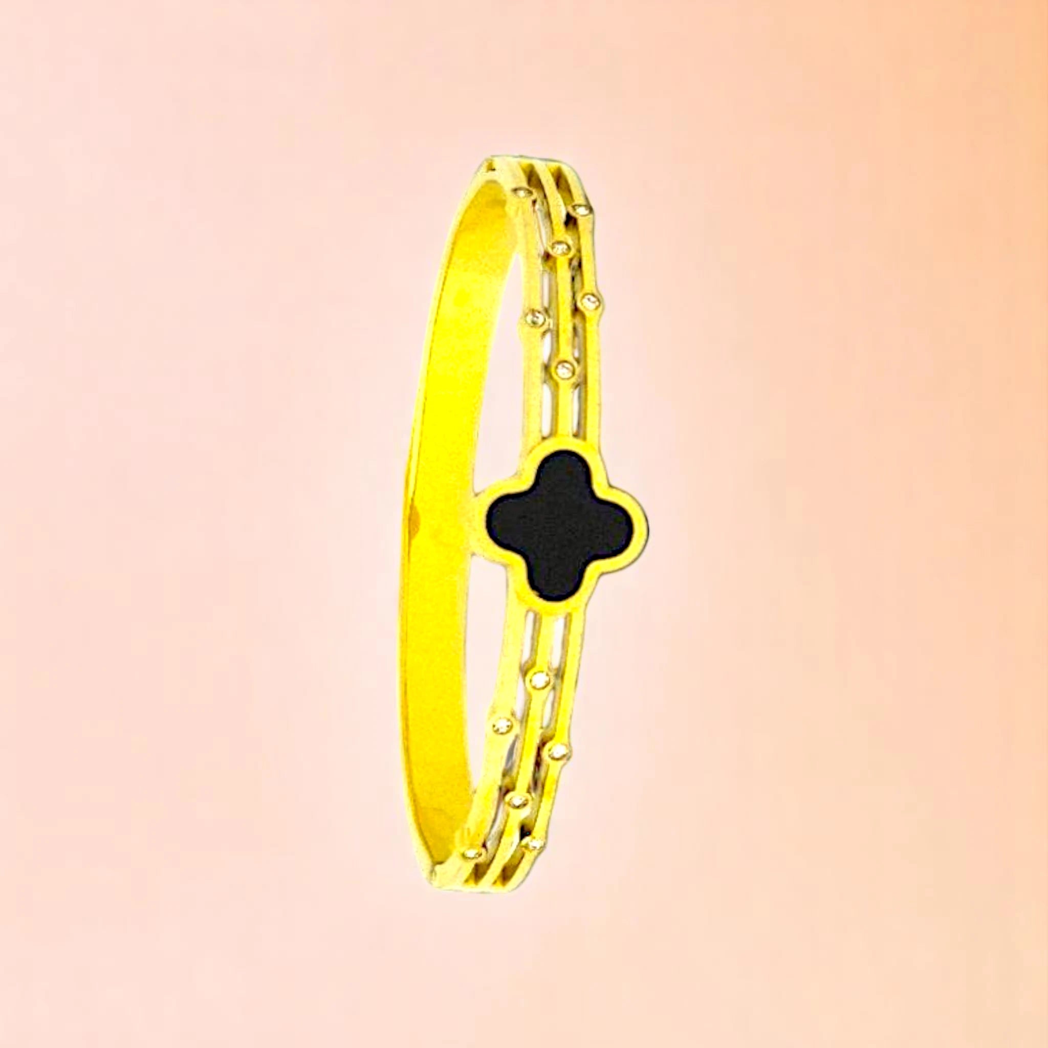 Bracelet on a color gradient of peach tones background.