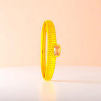 Bracelet set against a soft gradient background.