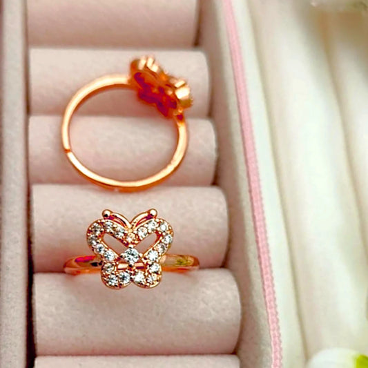 Two rings displayed in a velvet jewelry box.