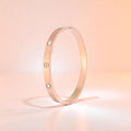 Bracelet set against a soft gradient background.