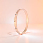 Bracelet set against a soft gradient background.