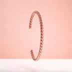 Bracelet on a color gradient of peach tones background.