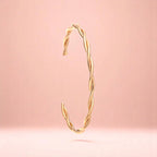 Bracelet on a color gradient of peach tones background.