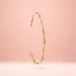 Bracelet on a color gradient of peach tones background.