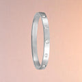 Bracelet on a color gradient of peach tones background.