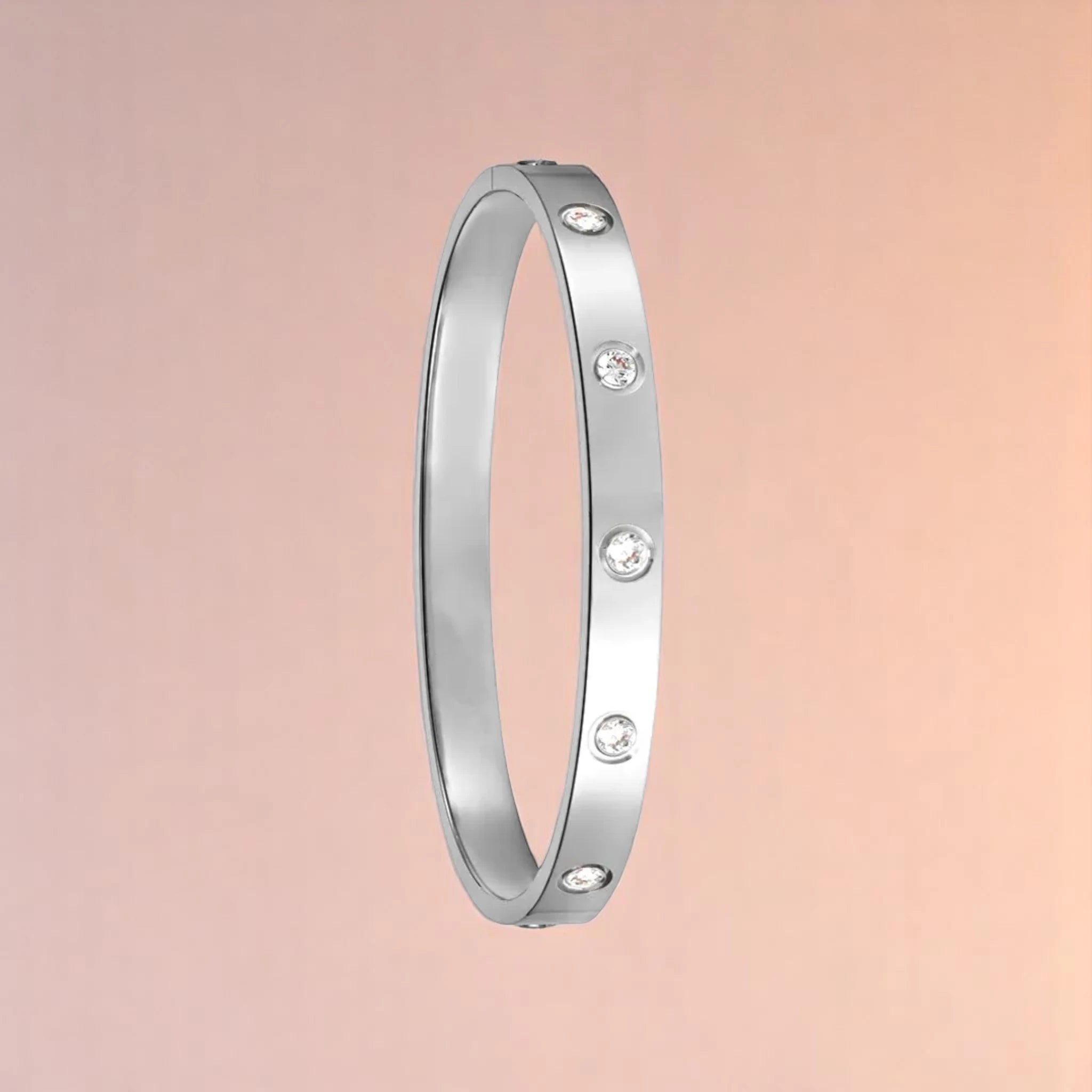 Bracelet on a color gradient of peach tones background.