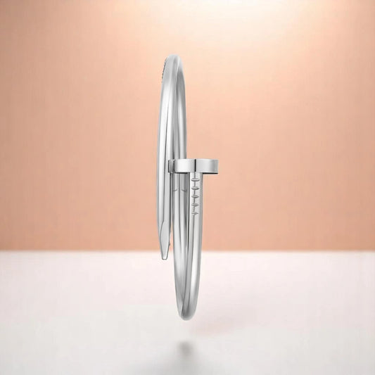 Bracelet on a color gradient of peach tones background.