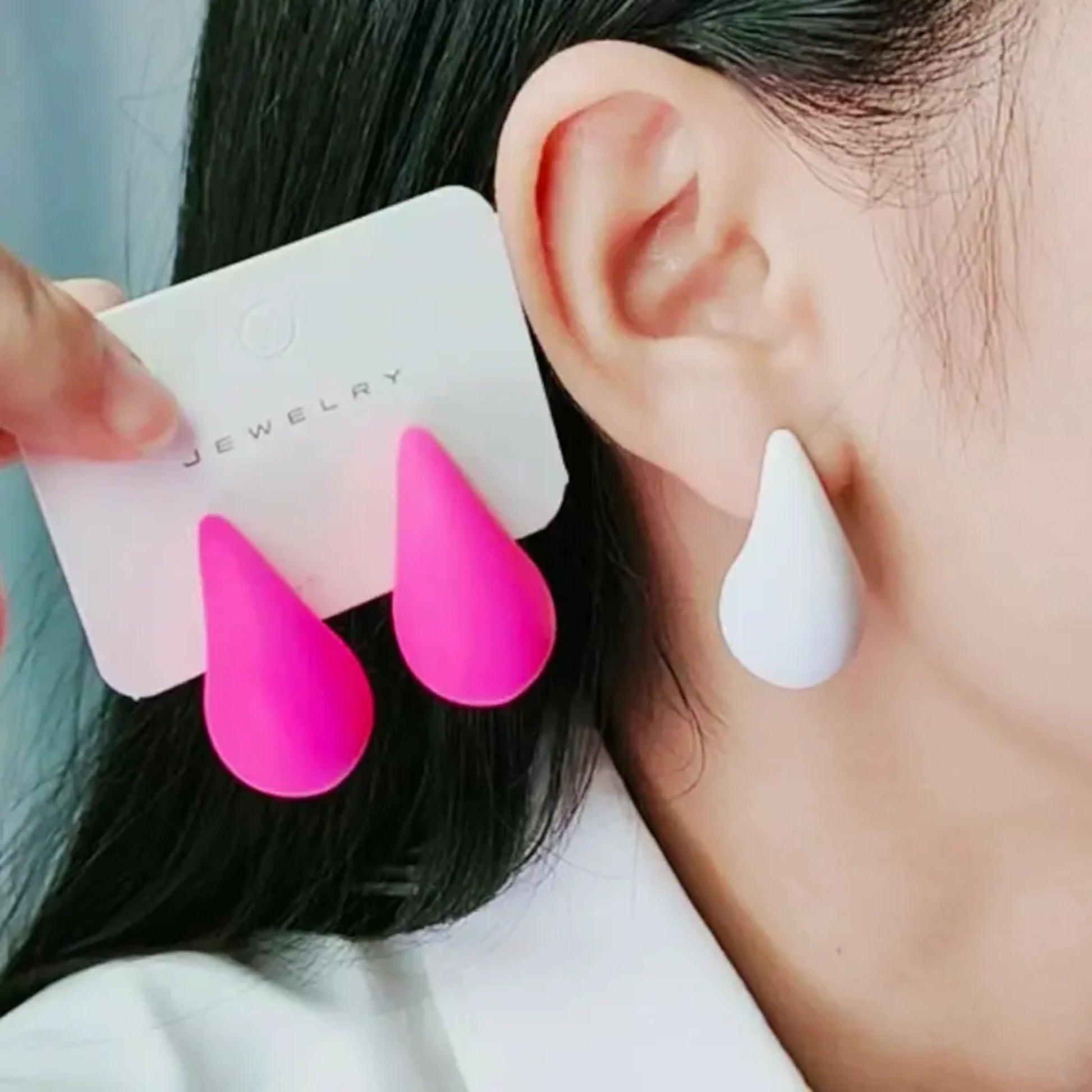 Snow White Teardrop Earrings worn by a model.