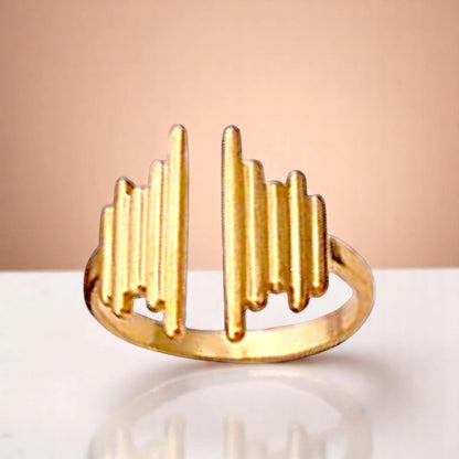 Ring on a color gradient of a peach-toned background.