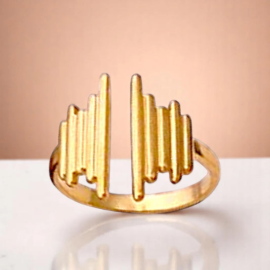 Ring on a color gradient of a peach-toned background.