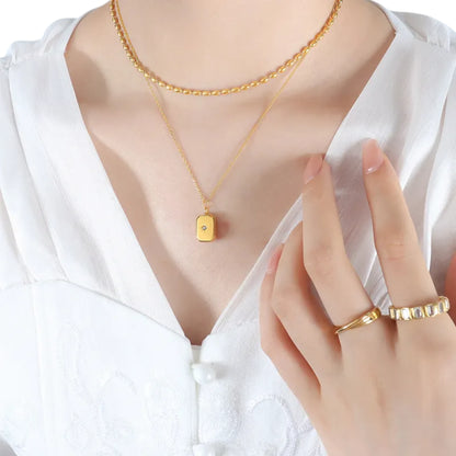 Necklace worn by a model.
