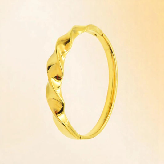 Bracelet on a color gradient of peach tones background.