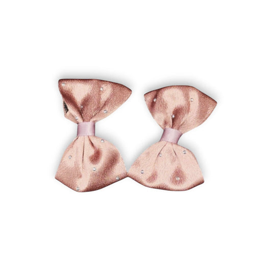 Two brown hair bows on a white background